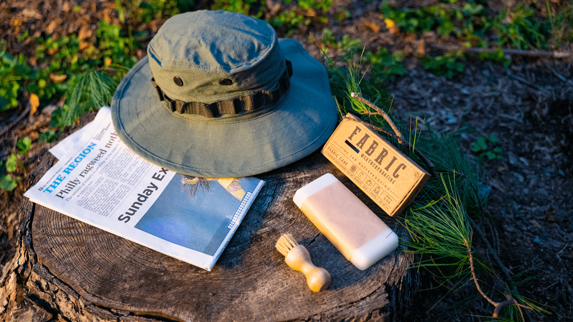 Fabric wax and canvas hat on a stump